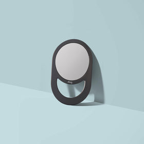 Diane mirror hung on hook demonstrating easy storage and space-saving benefit
