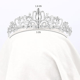 Didder tiara held in hand for scale to show compact, lightweight design