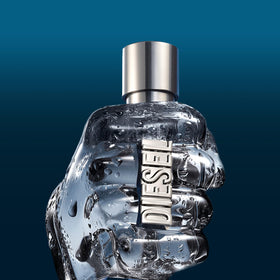 Diesel Only The Brave bottle next to hand for scale and travel-friendly size