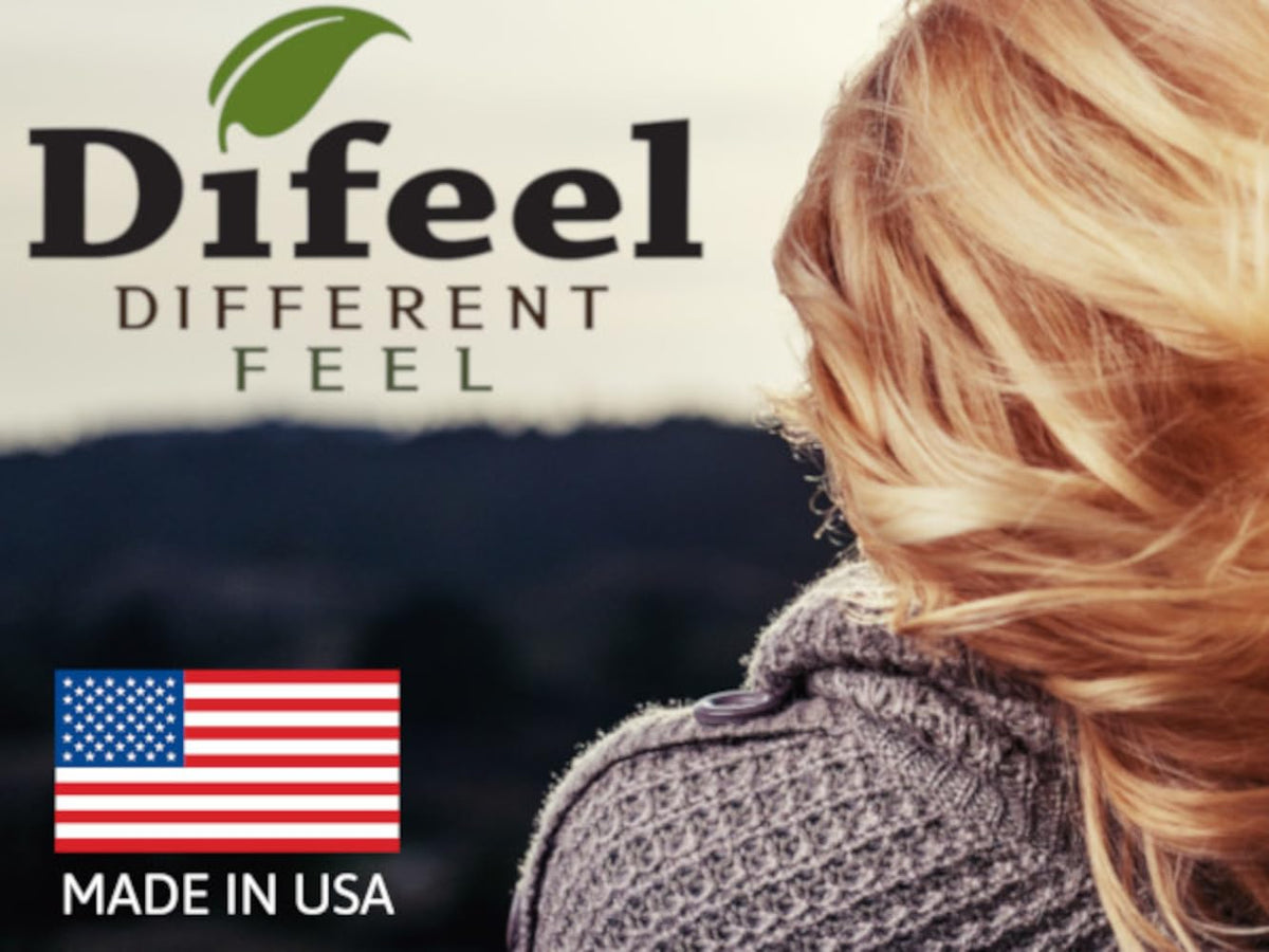 Difeel bottle staged with dried herbs to convey natural botanicals and soothing aroma benefit