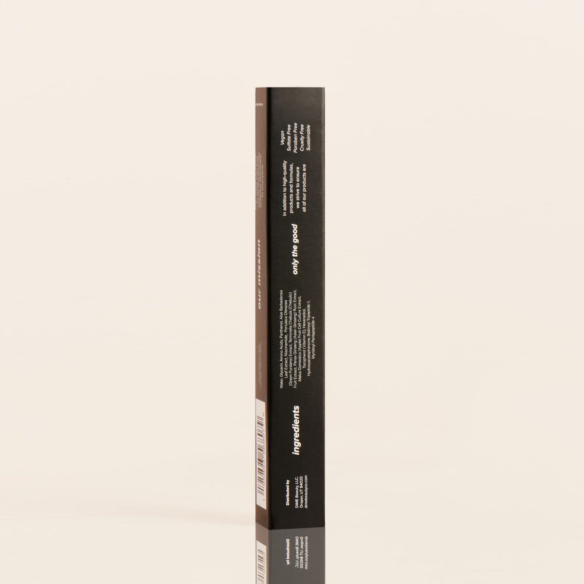 Serum paired with mascara and primer on vanity, DIME complements lash routine benefit
