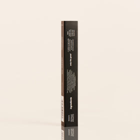 Serum paired with mascara and primer on vanity, DIME complements lash routine benefit