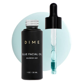 DIME blue facial oil front bottle shows elegant label and hydration benefit