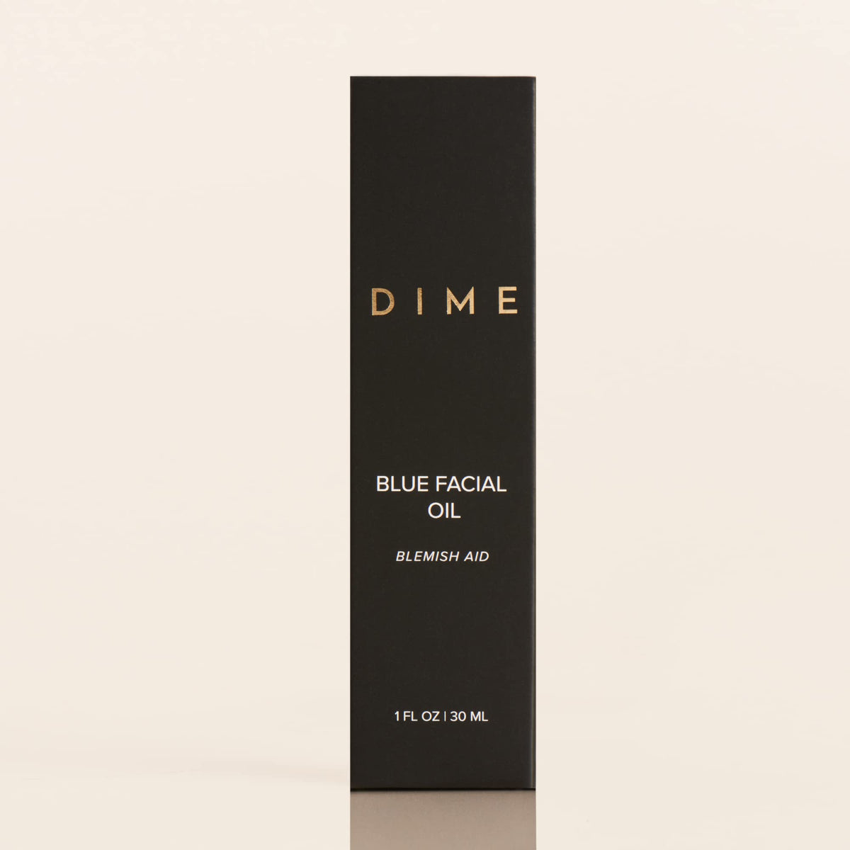 DIME blue facial oil on bedside table illustrating evening routine calming benefits