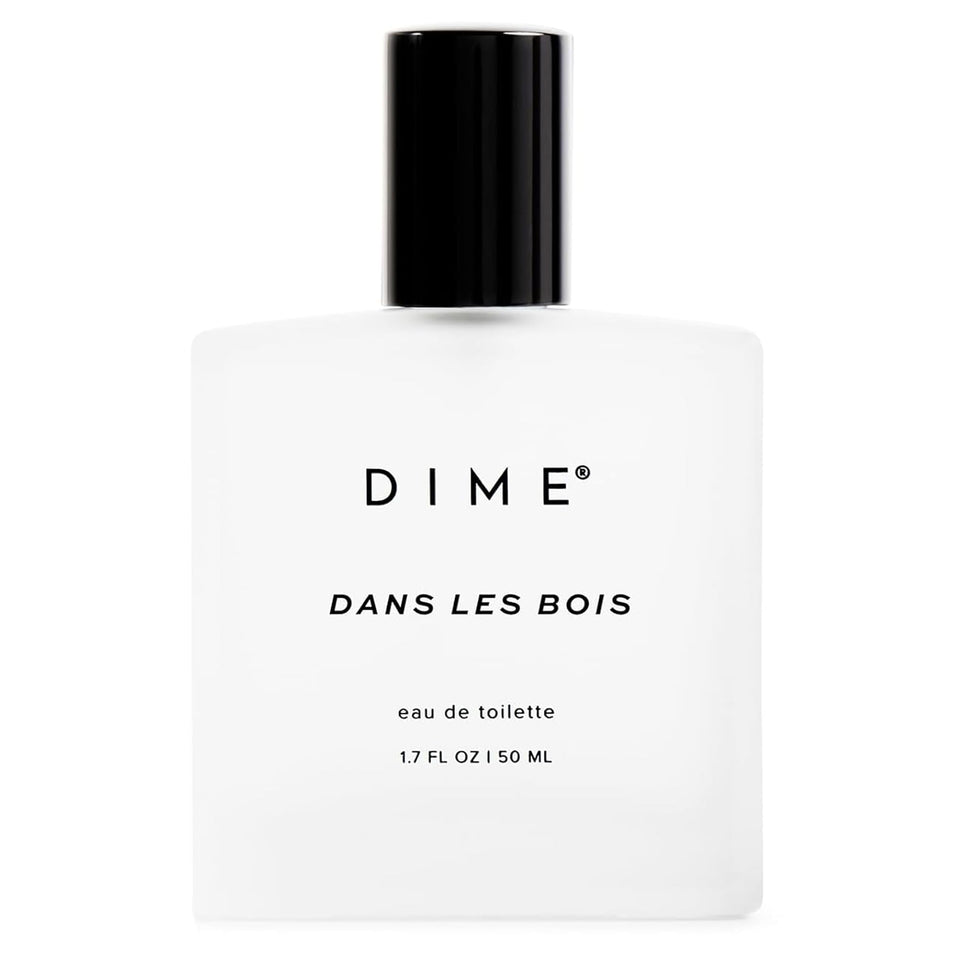DIME bottle front view showcasing elegant design and cedarwood scent