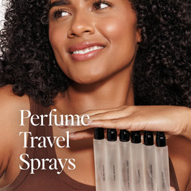 DIME perfume on a beach towel evoking coastal scent and sunset vibe