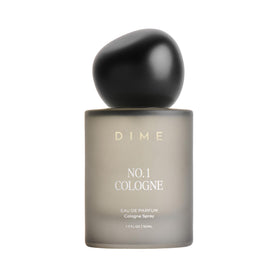 DIME front bottle showing label and glass, highlights bold rum scent