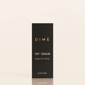 DIME TBT Serum in hand showing 1 oz size and travel-friendly