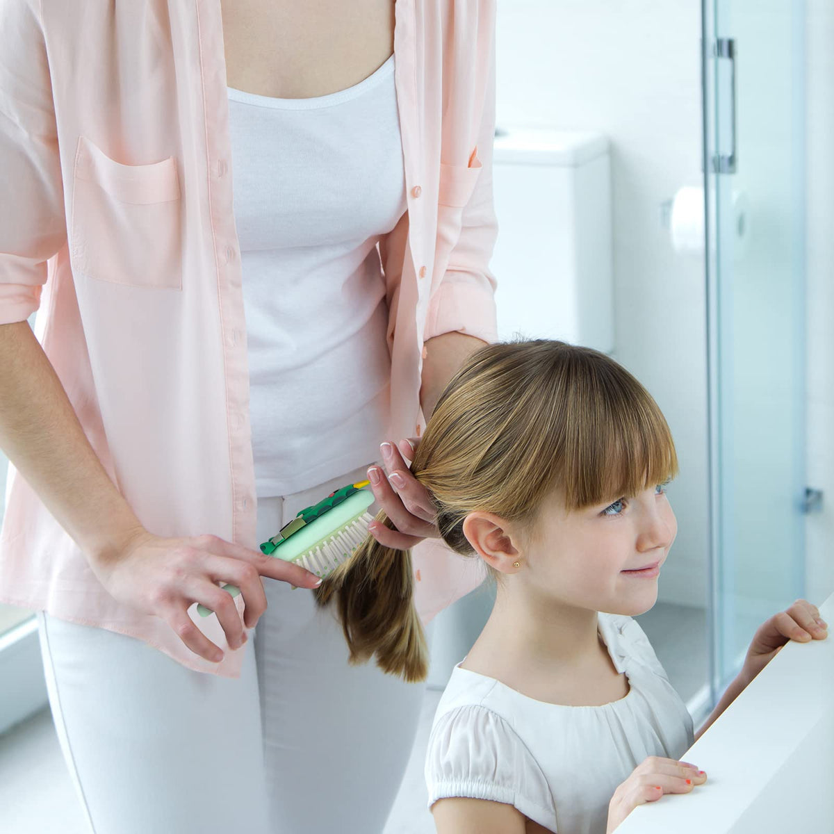 dinatis in hand scale demonstrates mini size and travel convenience