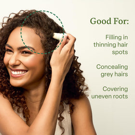 divi product being dabbed into hair part for instant concealment