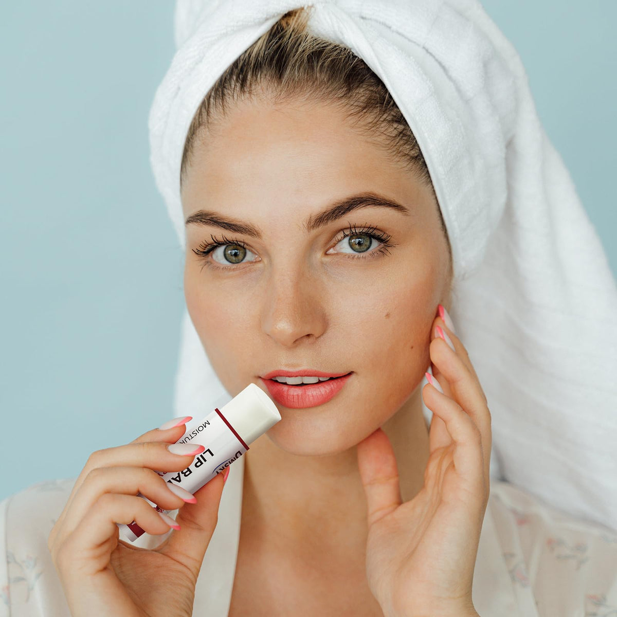 Dmsky balm being applied to lips showing immediate smoothing benefit