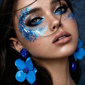 Dmsky tube with cap off showing gel nozzle and creamy glitter, easy precise application
