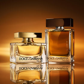 Dolce&Gabbana The One on a vanity with flowers suggesting sophisticated daily use
