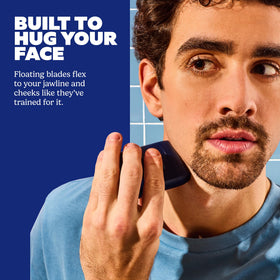 Dollar Shave Club shaver held in hand to show compact size and portability benefit