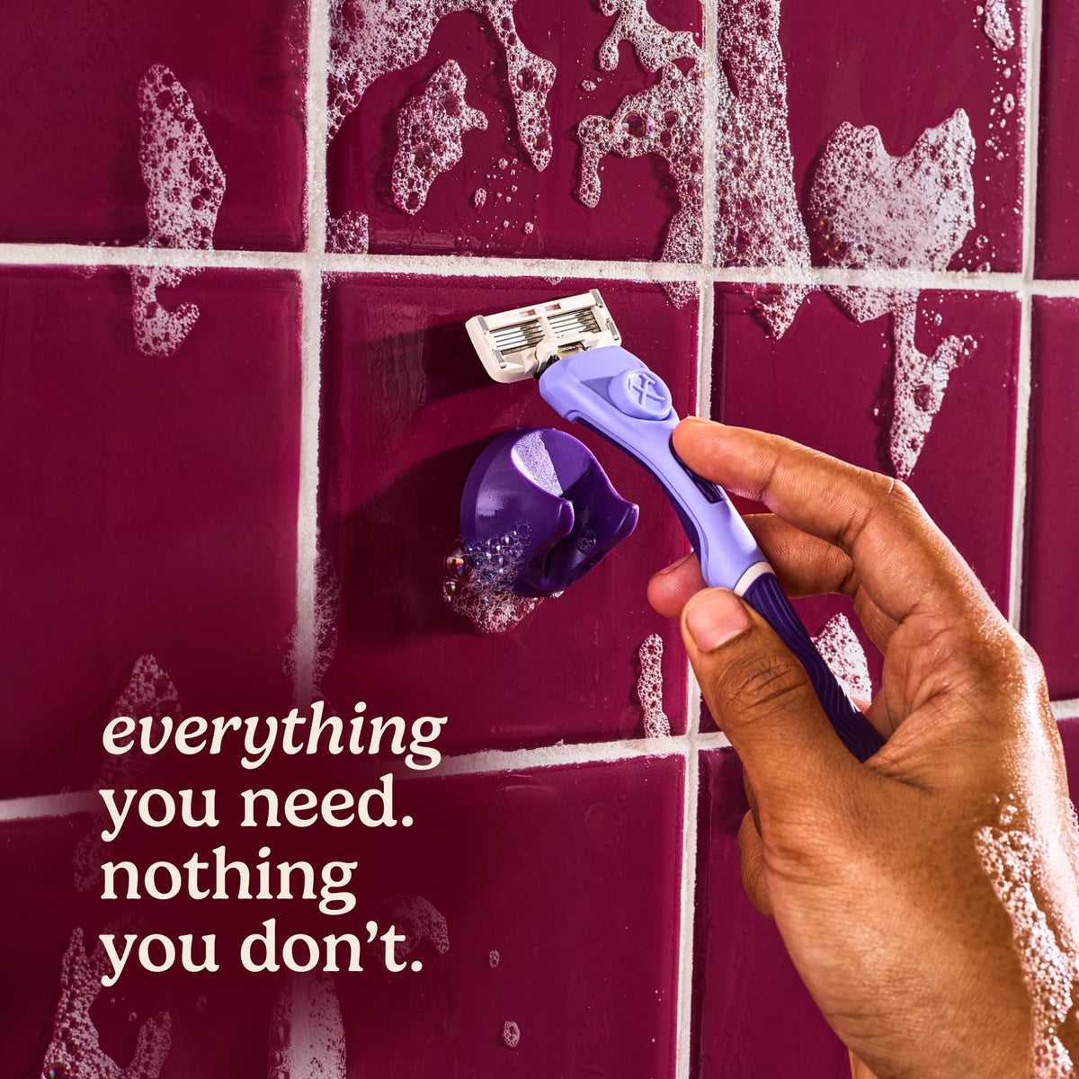 Dollar Shave Club handle held in hand demonstrating non-slip grip and easy maneuverability
