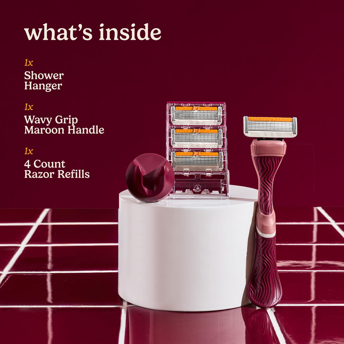 Dollar Shave Club maroon wavy grip handle closeup for secure control