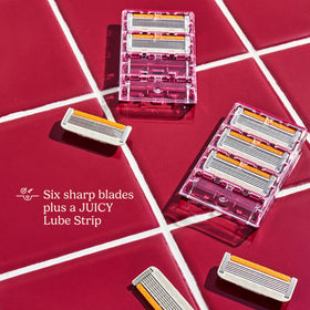 Dollar Shave Club razor next to ruler for scale showing compact, travel-friendly size