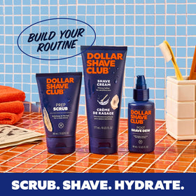 Dollar Shave Club tubes packed in a travel toiletry bag to show convenient 6 oz size for trips