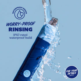 Dollar Shave Club trimmer being rinsed under tap for easy waterproof cleaning