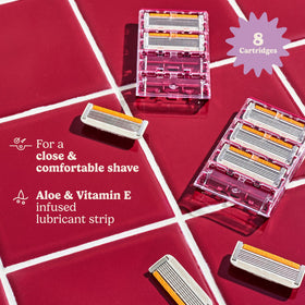 Close-up of six stainless steel blades on Dollar Shave Club refill demonstrating precision