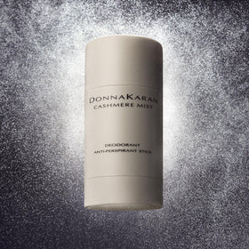 Donna Karan Cashmere Mist duo on white surface highlighting coordinated perfume and deodorant