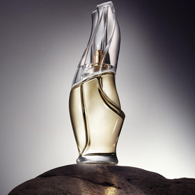 Donna Karan Cashmere Mist held in hand for scale and convenient everyday carry