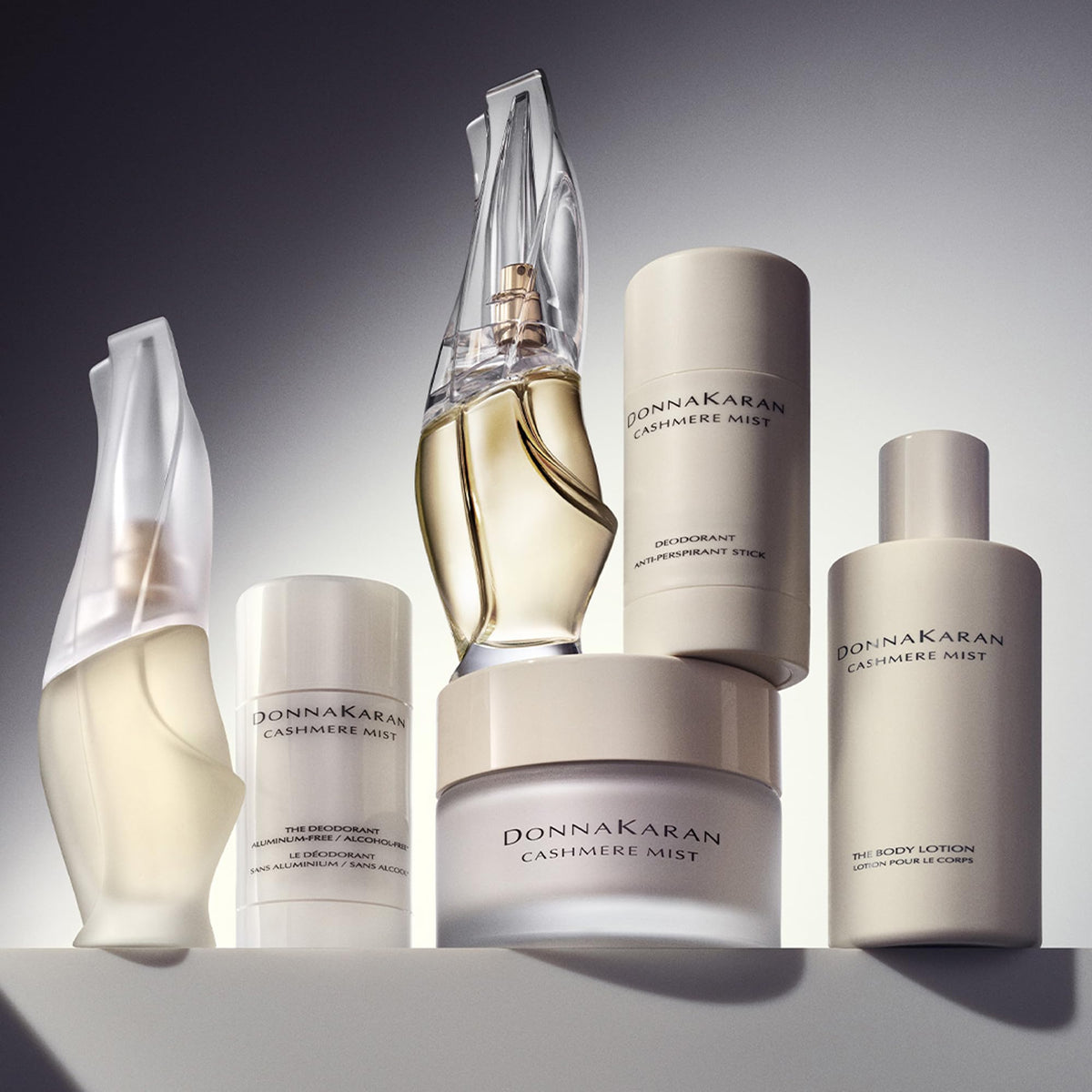 Donna Karan Cashmere Mist applying to elbow showing smoothing and moisturizing benefit