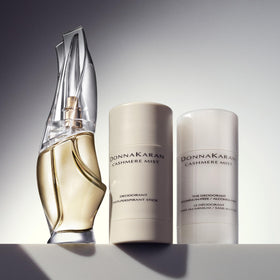 Donna Karan Cashmere Mist stick inside travel bag ready for on-the-go protection