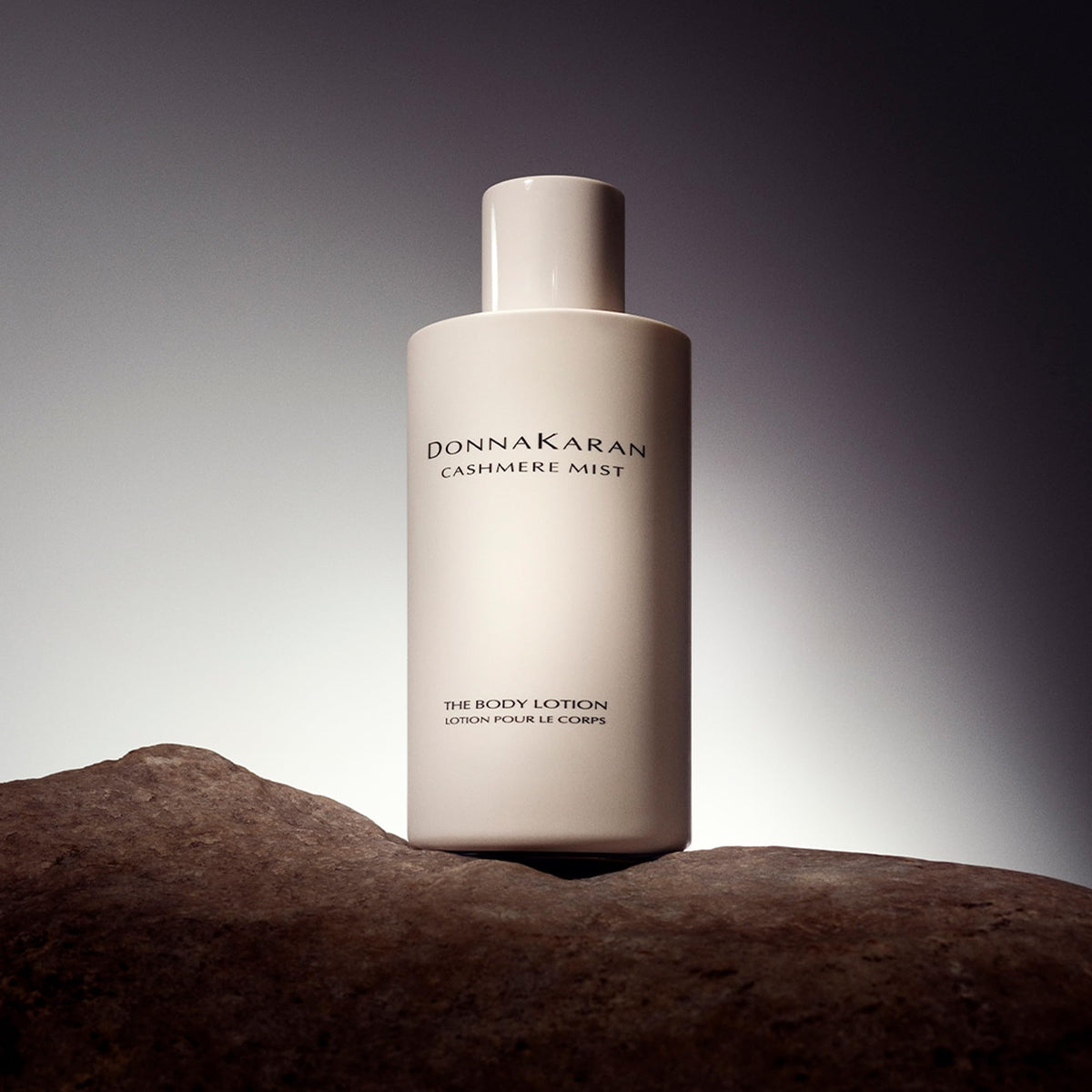Donna Karan Cashmere Mist creamy texture on hand showing fast absorption benefit