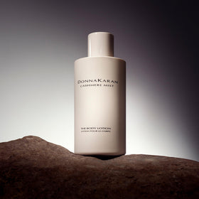 Donna Karan Cashmere Mist creamy texture on hand showing fast absorption benefit
