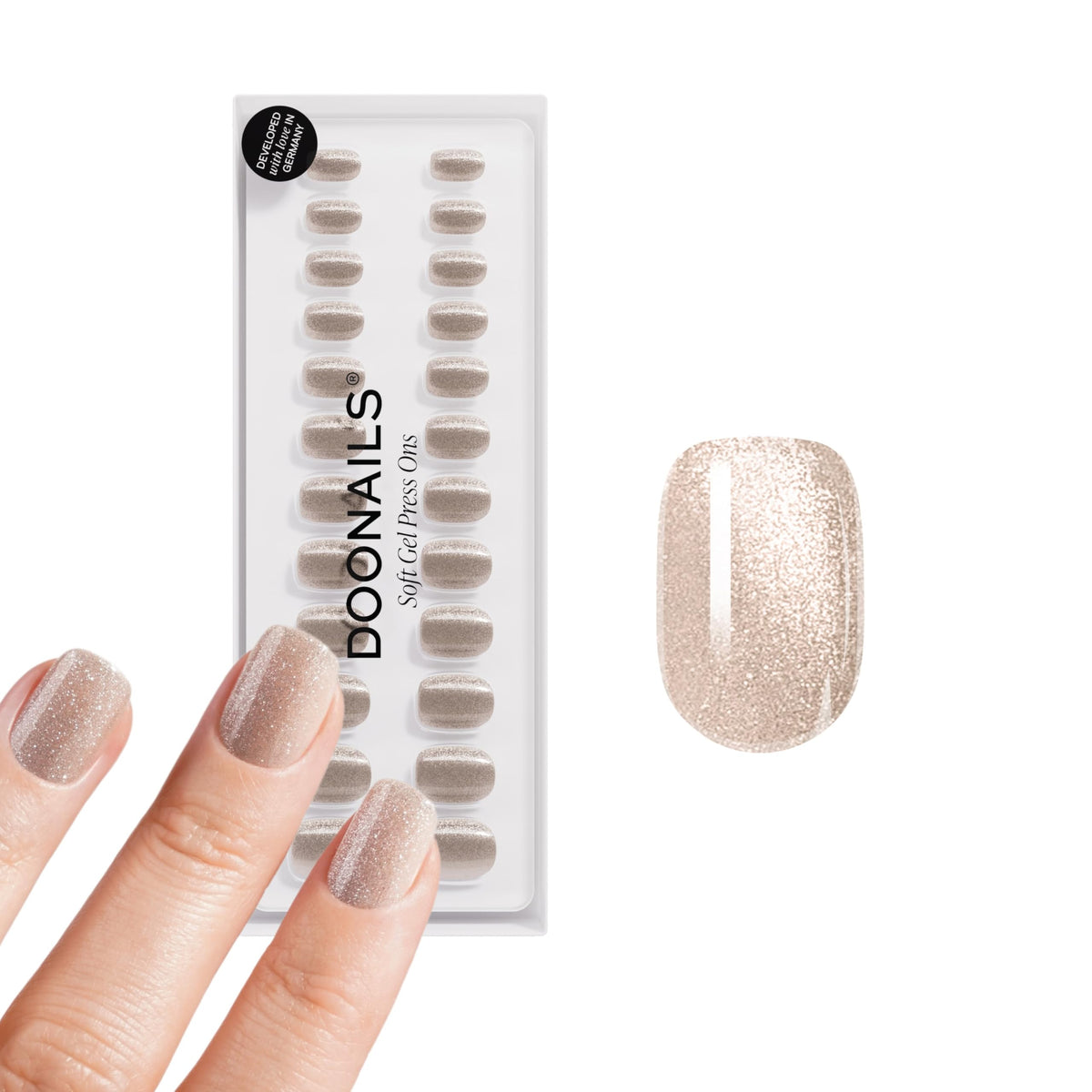 DOONAILS front packaging showing champagne metallic nails and kit contents for a polished look