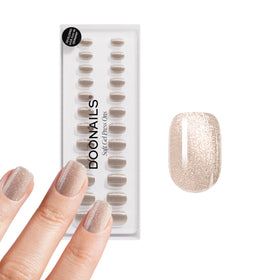 DOONAILS front packaging showing champagne metallic nails and kit contents for a polished look