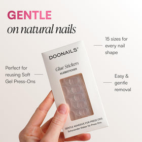DOONAILS tabs next to a hand for size comparison and tailored fit benefit