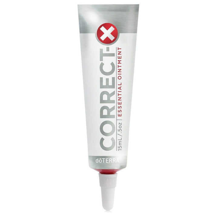 doTERRA Correct-X® tin front view showing compact ointment for targeted skin care