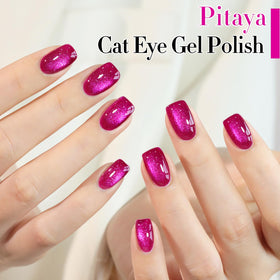 Double Rhythm magnet held near wet polish creating distinct cat-eye shimmer stripe