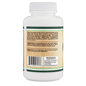 Double Wood keratin bottle held in hand for size and serving-perception benefit