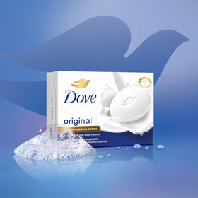 Dove bar in hand showing gentle cleansing and soft skin benefit