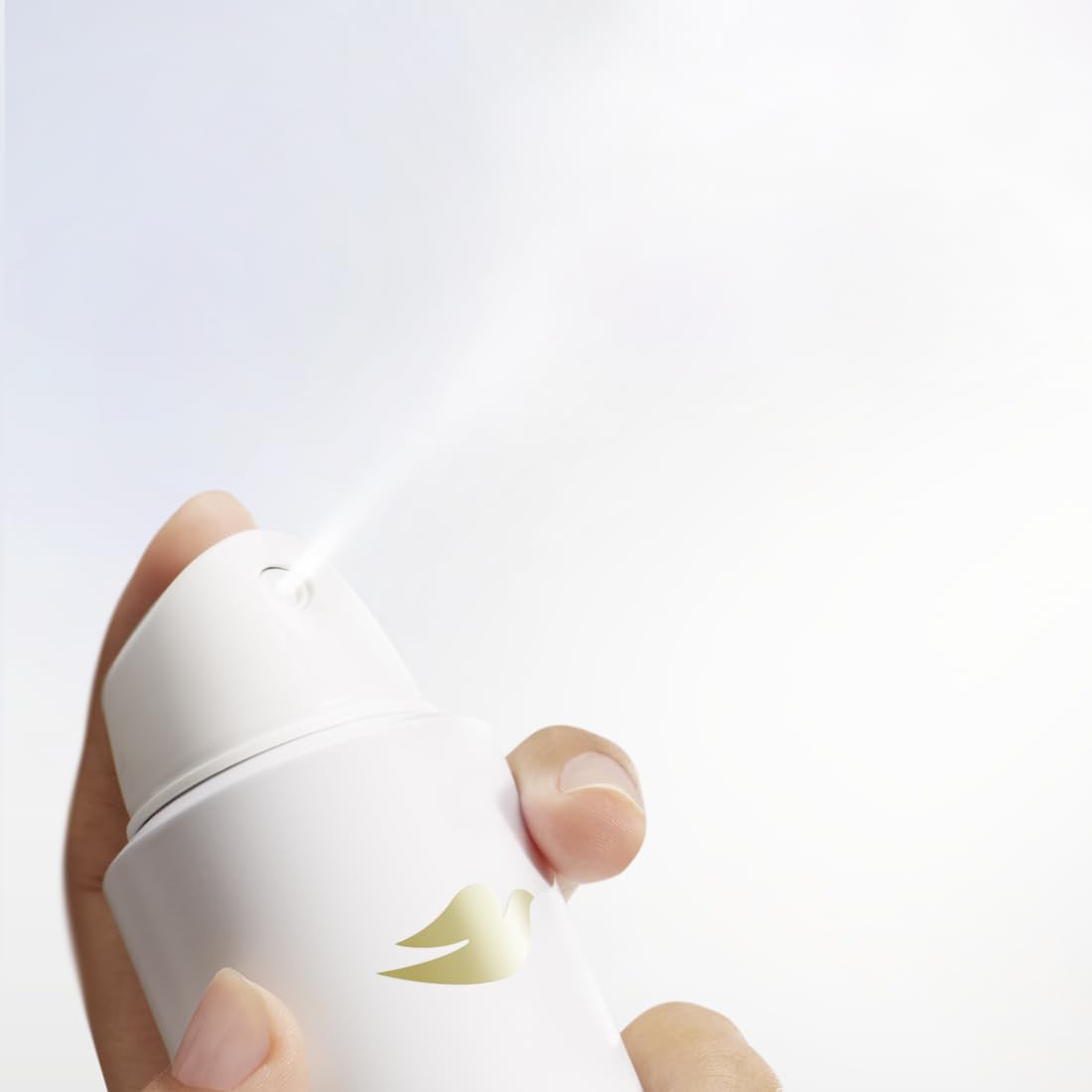Dove Clinical + Care held in hand to show compact travel-friendly size