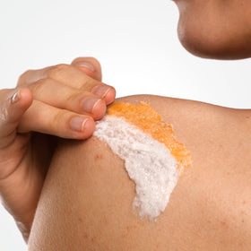 Dove tub beside common objects to show 15 oz size and portability
