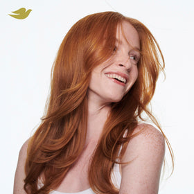 Smooth, styled hair after Dove conditioner showing reduced damage