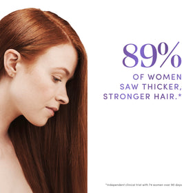 Dove Derma Scalp Density Boost massaging serum into scalp to support roots