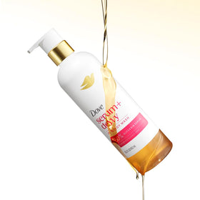 Dove shower oil poured onto hand demonstrating non-greasy hydration
