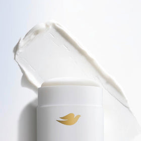 Label close-up on Dove stick showing nourishing serum and alcohol-free formula