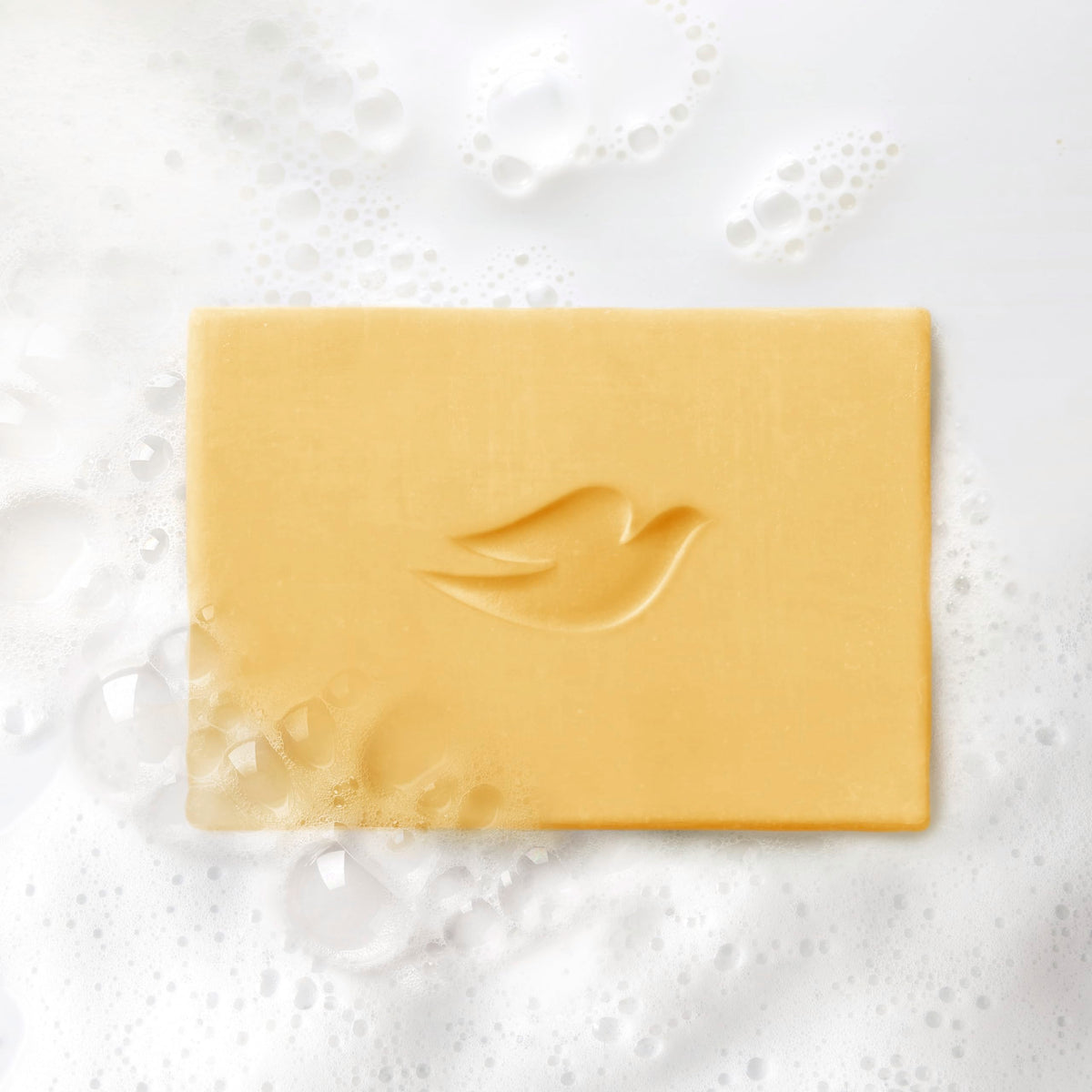 Dove bar on shower shelf illustrating lifestyle freshness and aroma boost