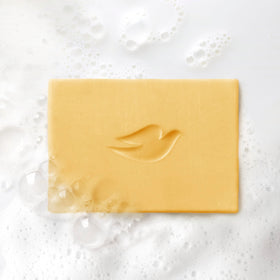 Dove bar on shower shelf illustrating lifestyle freshness and aroma boost
