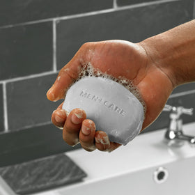 DOVE MEN + CARE close-up of bar texture highlighting moisturizing cream for hydration