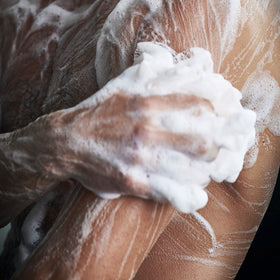 DOVE MEN + CARE in shower lifestyle shot delivering refreshing experience