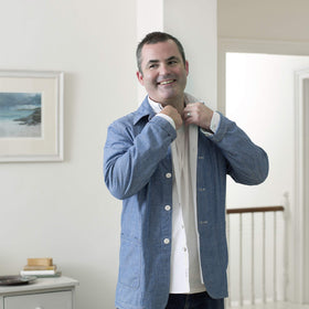Dove Men+Care deodorant in hand displaying 3 oz size for travel convenience