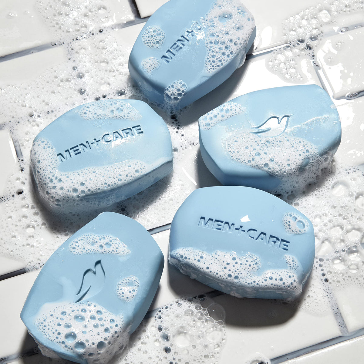 DOVE MEN + CARE bar in hand showing size and portability for gym or travel convenience