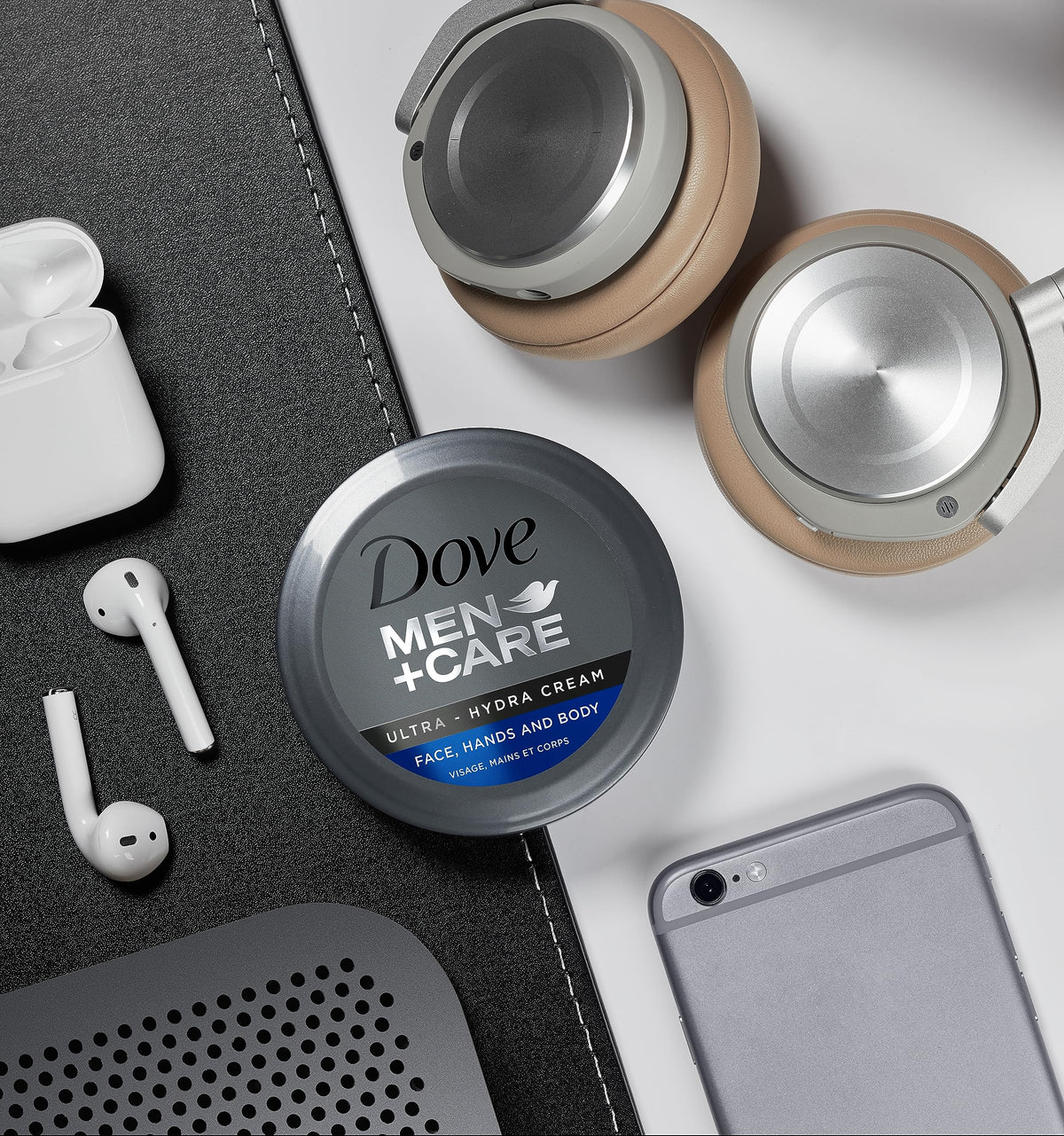 Dove Men+Care jar next to a water bottle for size and portability context